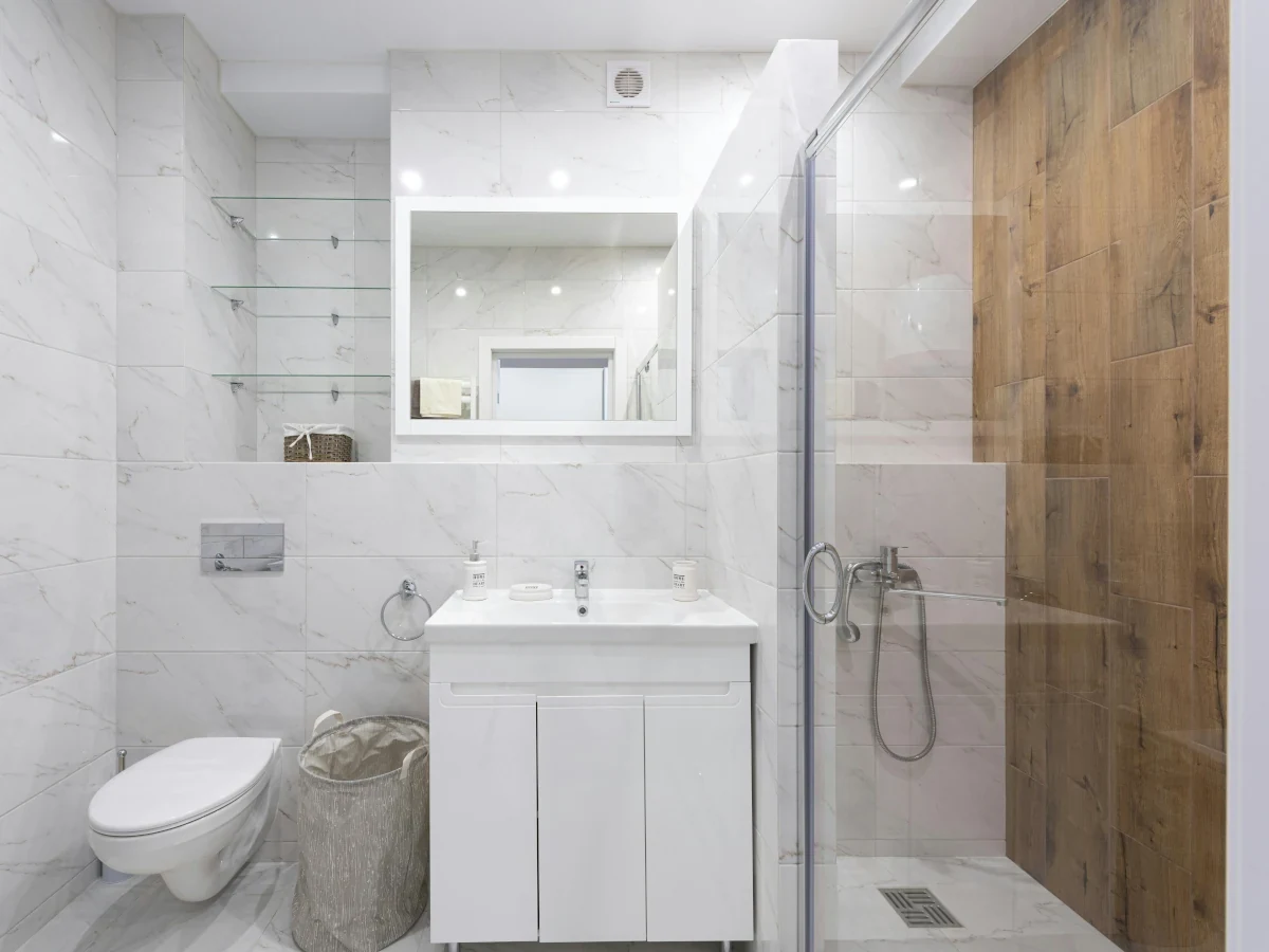 Contemporary shower with beige porcelain tiles installed in Swansea by Daffodil Tiling