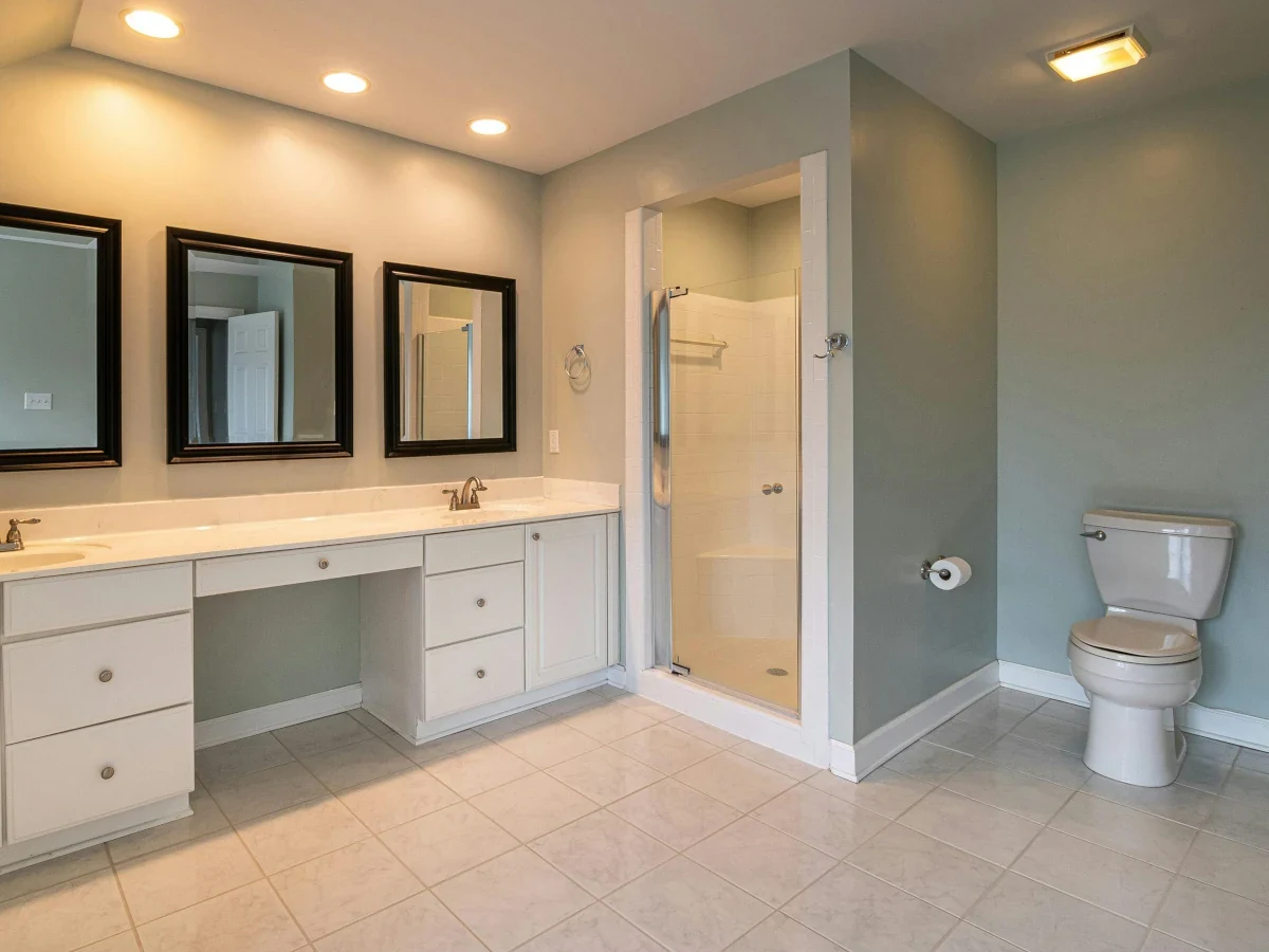 Bathroom with freestanding bath and tiled floor installed by Daffodil Tiling, Swansea