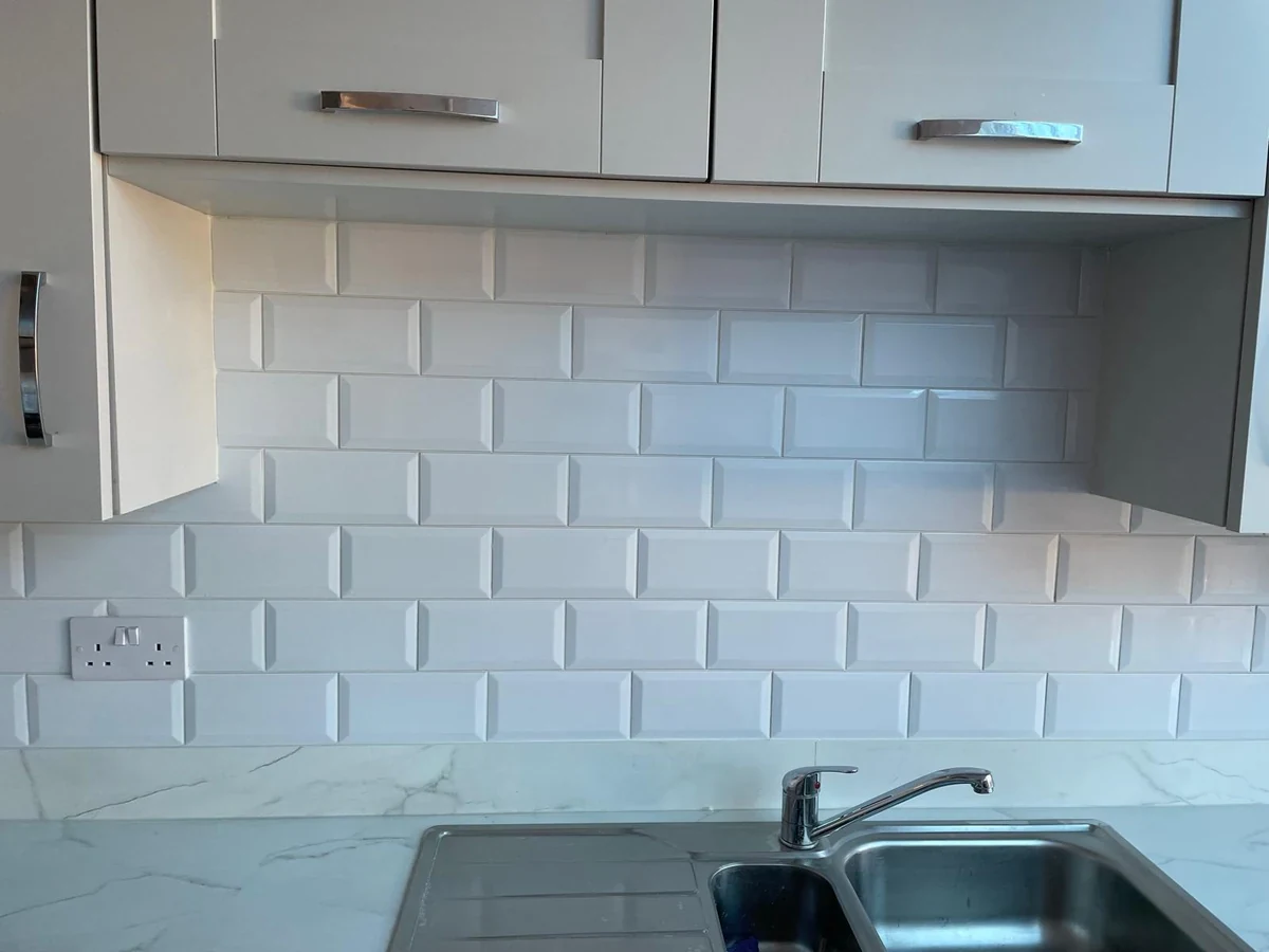 kitchen backsplash white subway tiles sink area swansea daffodil tiling