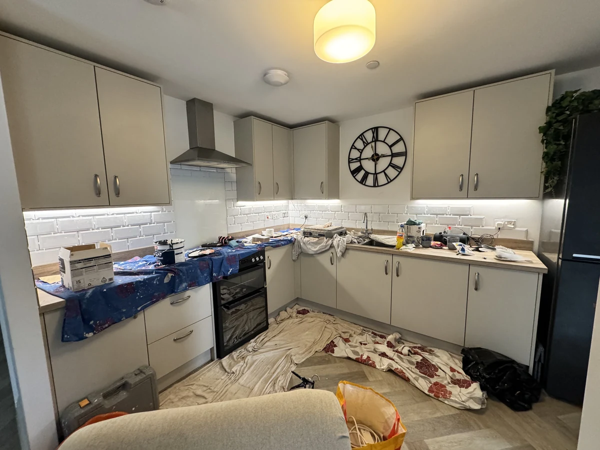 kitchen-tiling-in-progress-swansea-daffodil-tiling Mid-job: half the splashback tiled, tools everywhere, Swansea