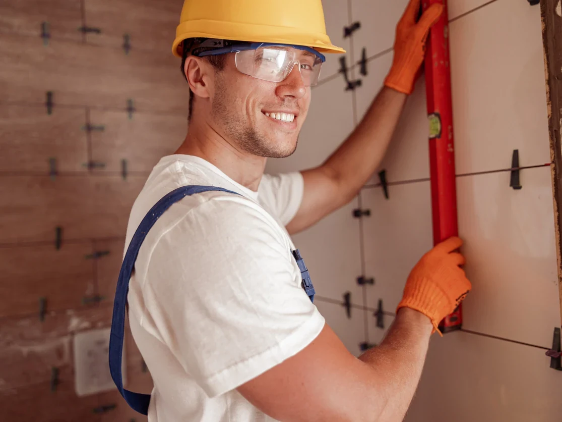 professional-tiler-measuring-tile-installation-daffodil-tiling Professional tiler measuring and setting out tiles for a floor installation by Daffodil Tiling